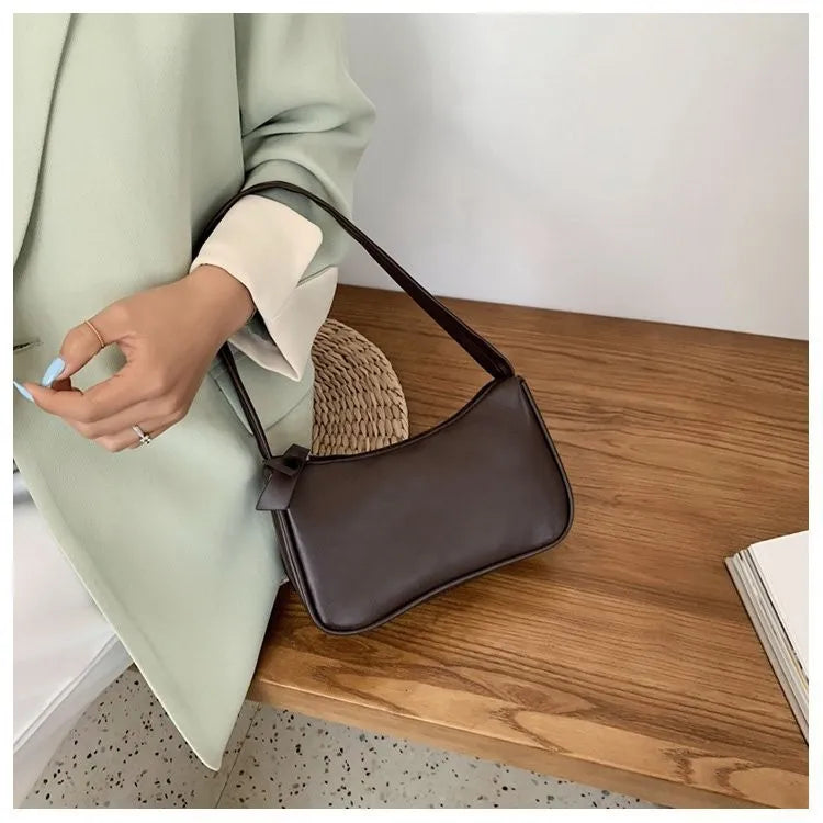 Bolso retro con lazo para mujer, bolso baguette de piel sintética, bolso de hombro estilo occidental, bolso de hombro con protección contra la humedad en las axilas.