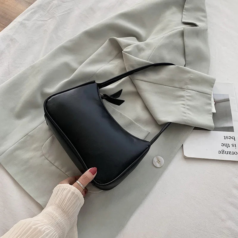 Bolso retro con lazo para mujer, bolso baguette de piel sintética, bolso de hombro estilo occidental, bolso de hombro con protección contra la humedad en las axilas.