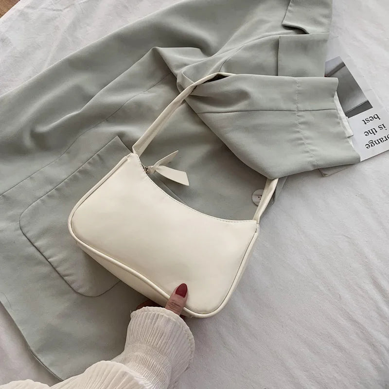 Bolso retro con lazo para mujer, bolso baguette de piel sintética, bolso de hombro estilo occidental, bolso de hombro con protección contra la humedad en las axilas.